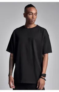 Close-up detail of a men's plain black short sleeve crewneck oversized casual t-shirt.