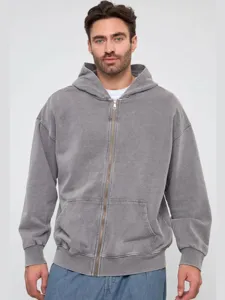 Close-up detail of the vintage washed grey zip-up hoodie featuring a cozy hood and metal zipper.