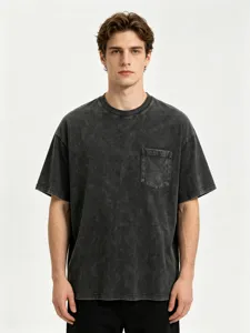 Washed cotton short sleeve t-shirt detail showing chest pocket and vintage dark gray fabric.