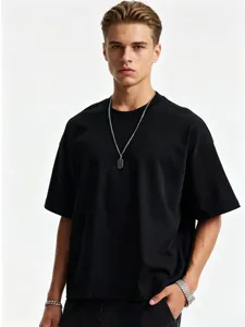 Detail shot of a men's black oversized dropped shoulder short sleeve t-shirt with chain.