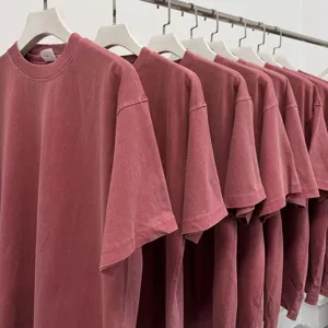 Detail view of heavy vintage washed short sleeve t-shirt in solid red, premium cotton tee.