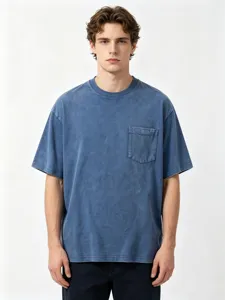 Close-up detail of vintage washed cotton men's short sleeve t-shirt showing chest pocket.