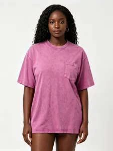 Closeup view of vintage washed oversized short sleeve t-shirt with chest pocket design.