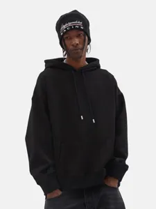 Sweat-shirt à capuche noir en coton lourd vue détaillée, style hip-hop streetwear.