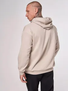 Detailed view of the back and hood of the solid color casual fleece hoodie in oatmeal.