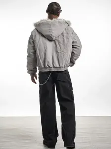 Men's gray hooded winter padded jacket with faux fur trim and casual cargo pants detail.