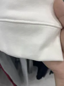 Fabric and stitching detail of the heavy solid color hoodie, showing premium loop fleece.