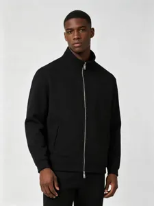 Detailed view of men's black mock neck full-zip sweatshirt, featuring sturdy metal zipper.