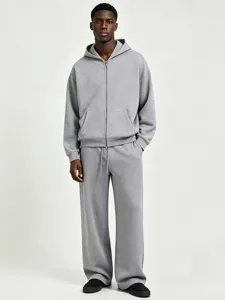 Men's heavy grey zip-up hoodie and matching sweatpants tracksuit set casual wear.
