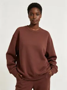Detail view of the heavy fleece crewneck sweatshirt, featuring a comfortable relaxed fit and ribbed trim.