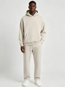 Detail view of solid color fleece hoodie and sweatpants set worn by model for casual style.