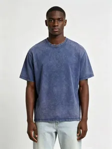 Close-up detail of a vintage acid-washed short-sleeve t-shirt with loose dropped shoulders.