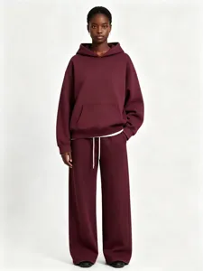Close-up details showcasing the fleece texture of this solid burgundy hoodie and pants.