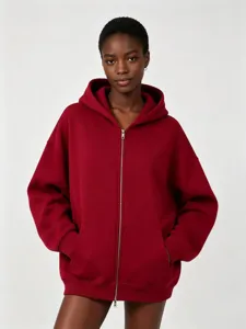 Burgundy heavy fleece zip-up hoodie detail, featuring soft hooded design and front pockets.