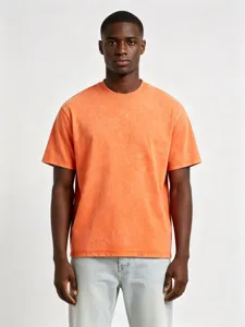 Close-up detail of the retro washed orange loose-fit cotton short-sleeve t-shirt top.