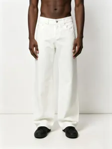 Detailed view of white straight-leg denim trousers, casual loose fit design, retro style.