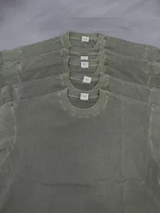 Heavyweight vintage wash short sleeve t-shirt detail showing neat collar tag and fabric texture.