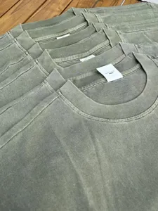 Vintage washed solid color cotton t-shirt detail showing soft fabric texture and collar design.