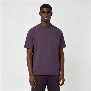 Dark purple short sleeve t-shirt detail with unique shoulder panel design and crew neck.