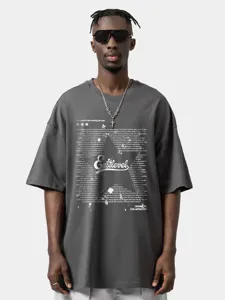 Oversized dark grey streetwear t-shirt detail featuring graphic text print and dropped shoulders.