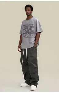 Vintage washed graphic short sleeve t-shirt scene detail in hip hop streetwear style.