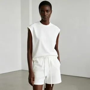 Minimalist men's white sleeveless muscle tee and shorts athletic set for summer gym wear.