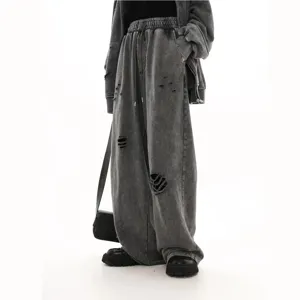 Distressed cotton fleece sweatpants for men, loose fit wide leg casual trousers with cool style.