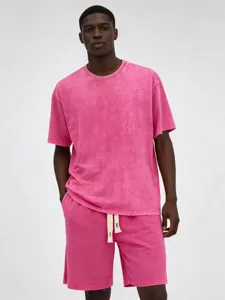 Men's washed pink short sleeve T-shirt and shorts set, casual streetwear distressed style.