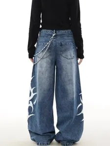 Back view detail of Y2K loose straight denim jeans featuring side tribal print and waist chain.