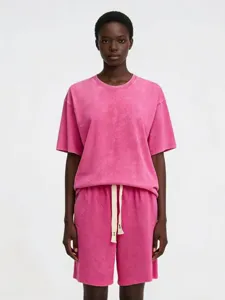 Detailed view of the mineral washed pink cotton short sleeve t-shirt and shorts set.