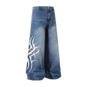 Vintage washed tribal print wide leg denim jeans, American hip hop streetwear casual pants.