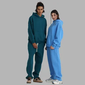 Detail view of fleece hooded sweatshirt and sweatpants set in stylish solid casual wear.