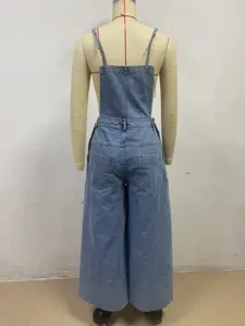 Back detail of women's light blue denim wide leg overalls with straps and back pockets.
