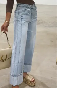 Women casual loose mid-rise straight washed fashion jeans with cuffed hem detail.