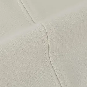 Close-up fabric texture detail of casual t-shirt, showing soft terry cloth and neat stitching.