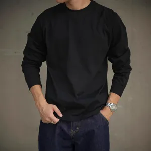 Close-up detail view of men's black heavy cotton raglan long sleeve t-shirt, daily wear.