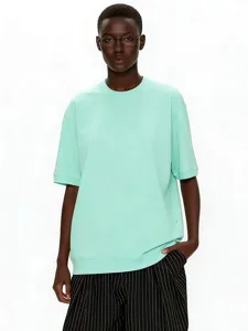 Detail view of the loose terry cloth short sleeve t-shirt with ribbed hem details.