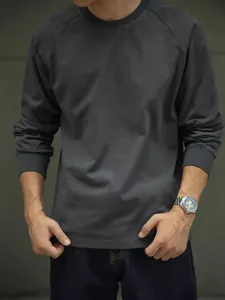 Heavyweight cotton raglan long sleeve t-shirt for men, casual solid color crewneck apparel.