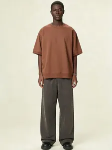 Loose drop-shoulder terry cloth t-shirt for men and women, solid color casual top with ribbed hem.