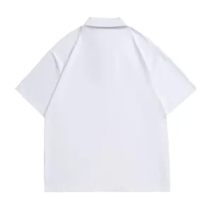 Detailed view of solid white short sleeve polo shirt, lapel collar, plain design, back side.