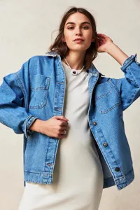 Casual blue denim jacket for women featuring classic pockets and metal buttons for everyday wear.