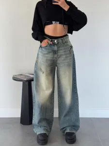 Jean femme vintage délavé effet vieilli style streetwear coupe ample tendance chic