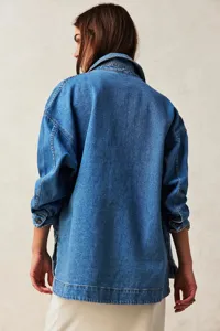 Detailed view of casual loose denim jacket for women featuring side slits and lapel collar.