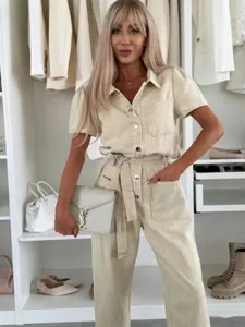 Women's casual short sleeve denim jumpsuit with belt and pockets for summer fashion style.