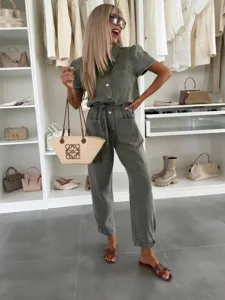 Casual washed lightweight denim jumpsuit for women, featuring short sleeves and belt.