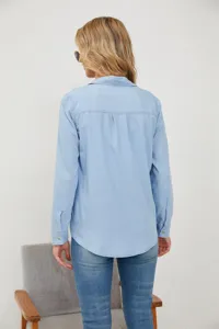 Back view detail of women light blue long sleeve denim shirt casual wear spring fashion.