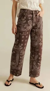 Brown paisley print denim jeans detail, relaxed fit casual style product close-up view