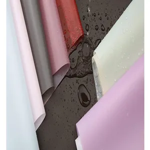 Waterproof floral wrapping paper detail, solid color bouquet packaging material for gifts.