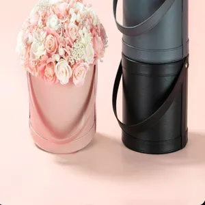 Leder Zylinder Blumenbox mit Griff, tragbare Geschenkverpackung für Blumenarrangements.