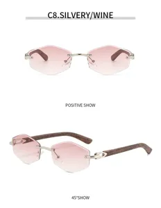Schicke rahmenlose Sonnenbrille mit rosa Farbverlauf, sechseckigen Gläsern und Holzoptik.